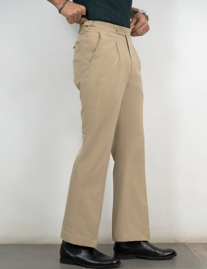 Drip Club Sandro light beige flared trousers worn by a model, true to size unisex fit
