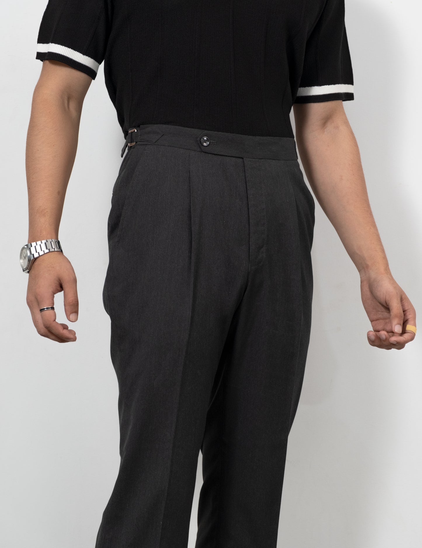 Drip Club Mistal charcoal grey flared trousers worn by a model, true to size unisex fit
