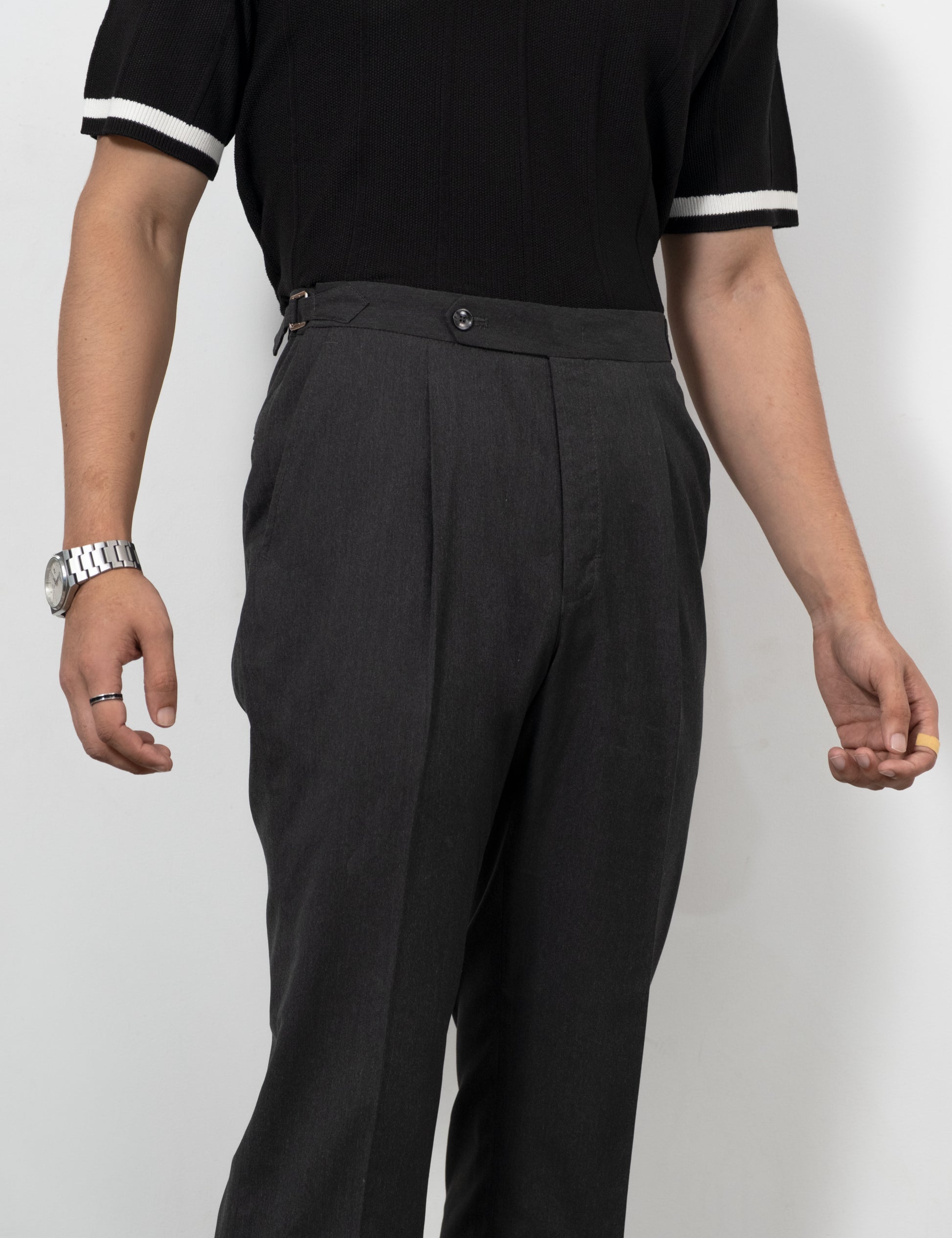 Drip Club Mistal charcoal grey flared trousers worn by a model, true to size unisex fit